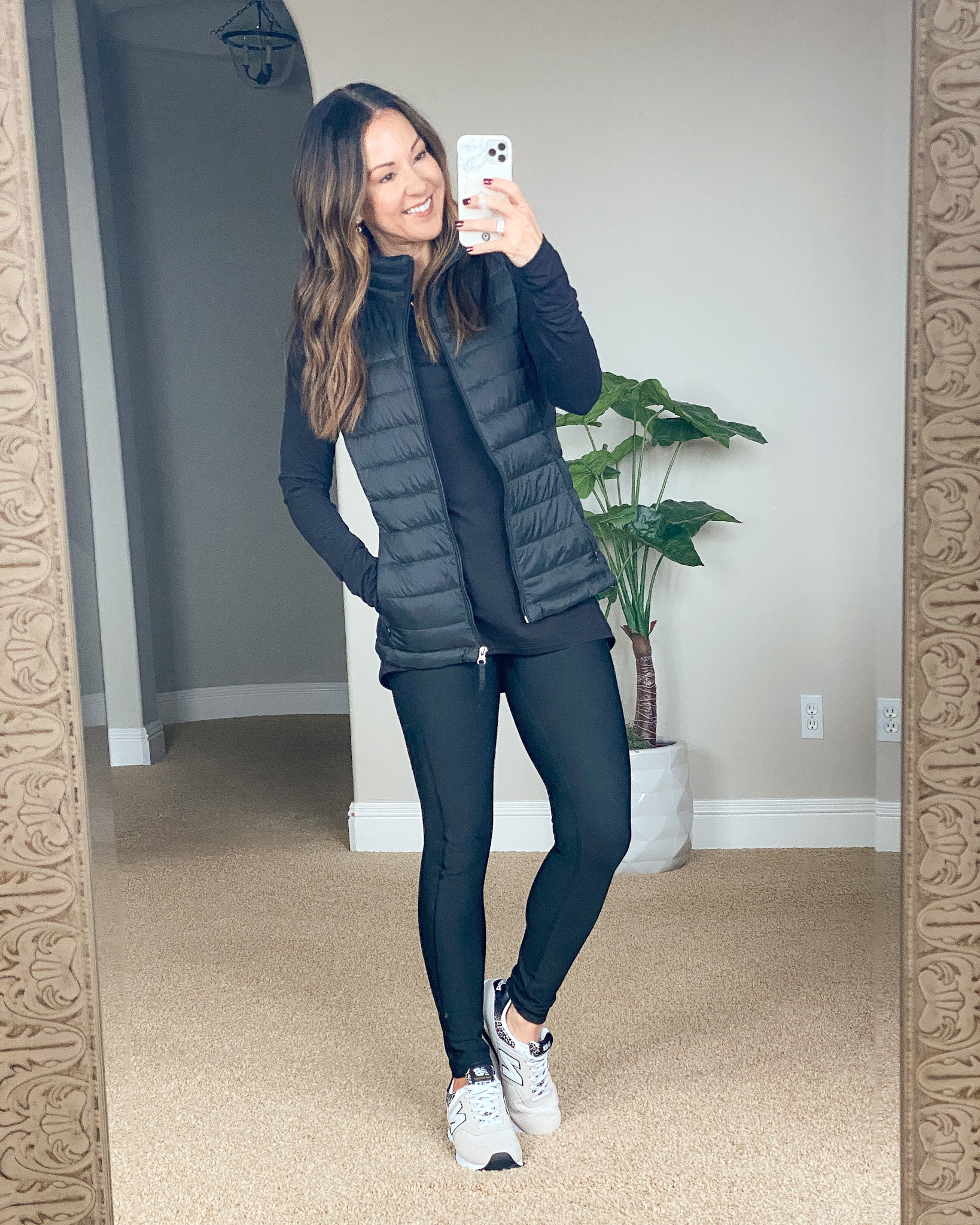 GHVHVDN1343028 image, top 10 fashion items, black puffer vest, leggings, black workout top, new balance sneakers 