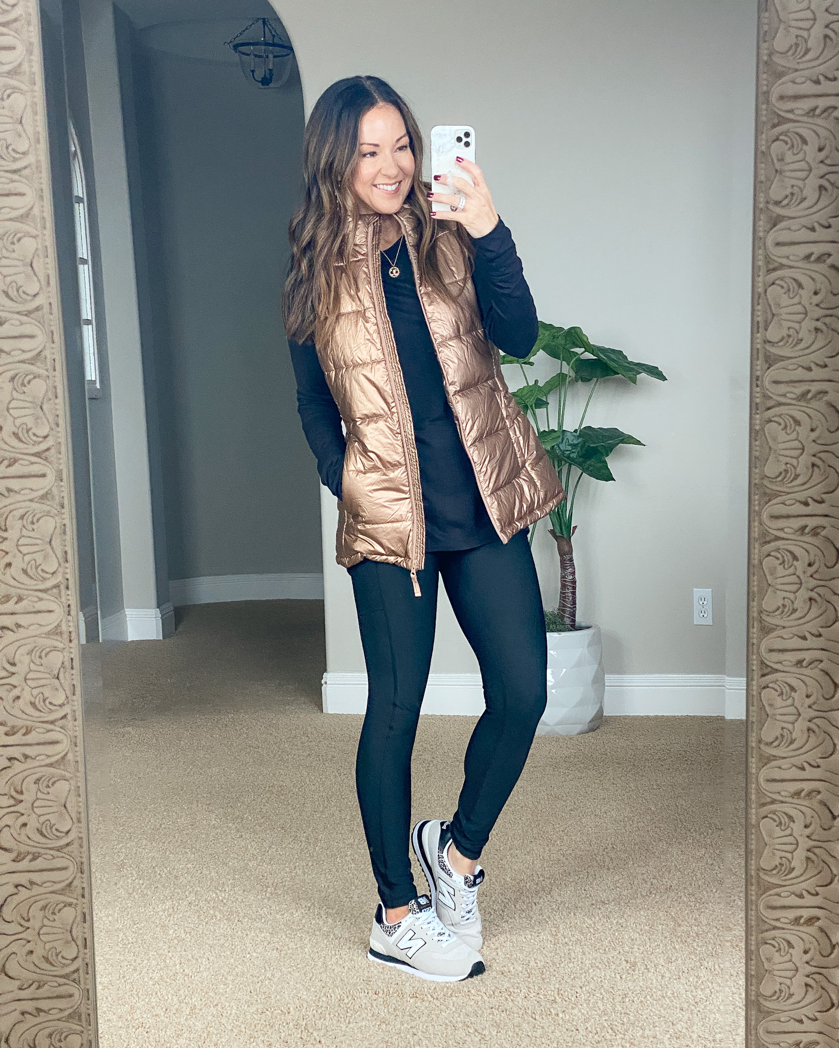 top 10 december items, black long sleeve top, metallic puffer vest, leggings, new balance sneakers 